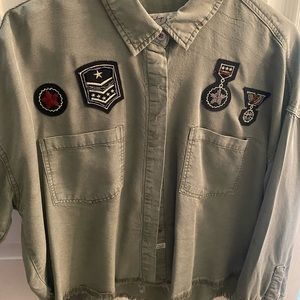 Green shirt/jacket with military patch detail and distressed bottom